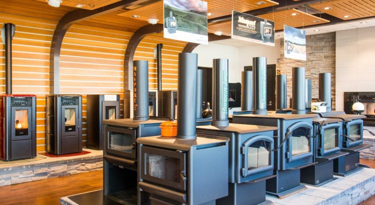 A warm showroom showing fires, pellet fires, log burners, heat pumps and heaters